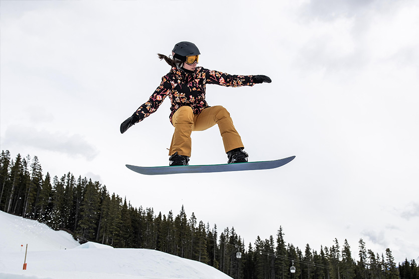 Female snowboarder shows off her stance