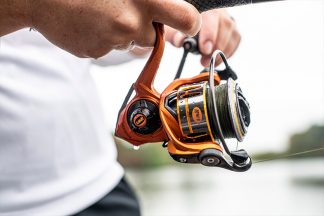 A man holding a spinning reel