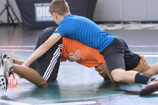 Two young wrestlers show how to sprawl.