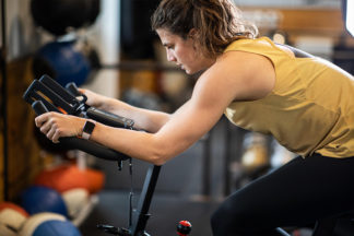 woman at the gym on exercise bike