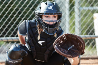 softball catcher learning how to block