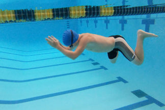 boy underwater doing the breaststroke