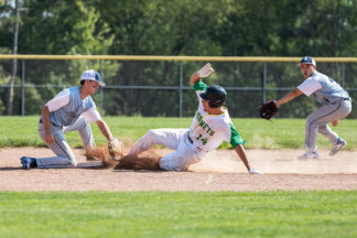 Baseball Player Sliding Into Second Base