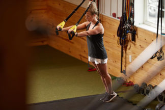 Woman Using Suspension Trainer