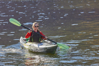 Kayaker Paddling On Water