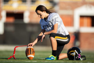 Football Player Setting Up For Field Goal