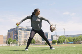 Professional Softball Player Aleshia Ocasio Throwing a Softball