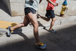 male and female runners with brooks running shoes