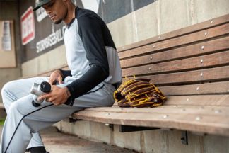 Baseball Player Using Hyperice Percussive Therapy Device