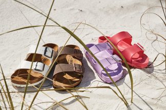A Collection Of Birkenstock Women's Sandals In Various Colors