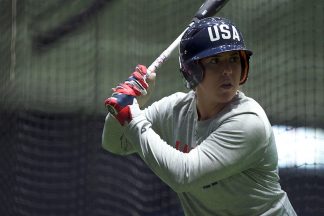 Amanda Chiddy Chidester hitting softball in the batting cages