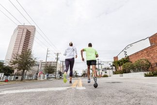 A man and a woman street running.