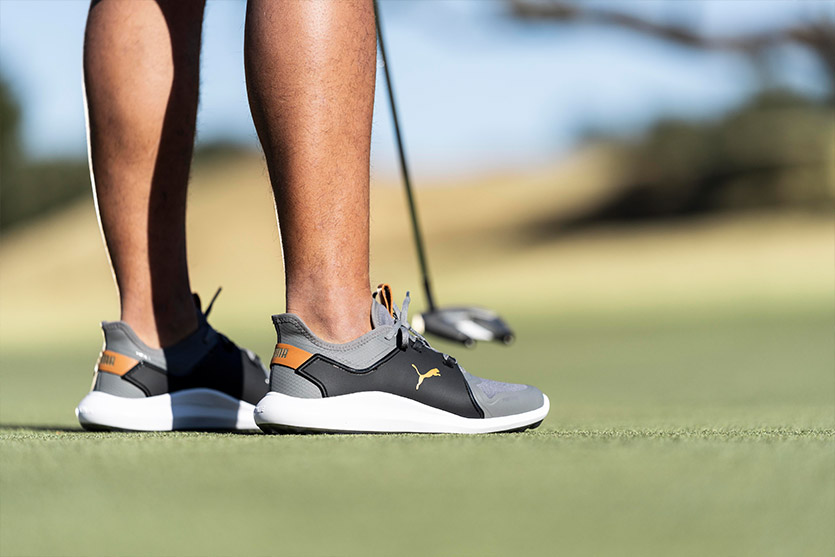 golfer wearing PUMA Ignite Fasten8 golf shoes on the course